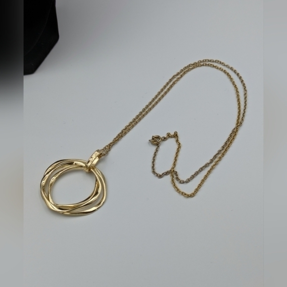 5/25$  Gold tone necklace with layered ring pendant